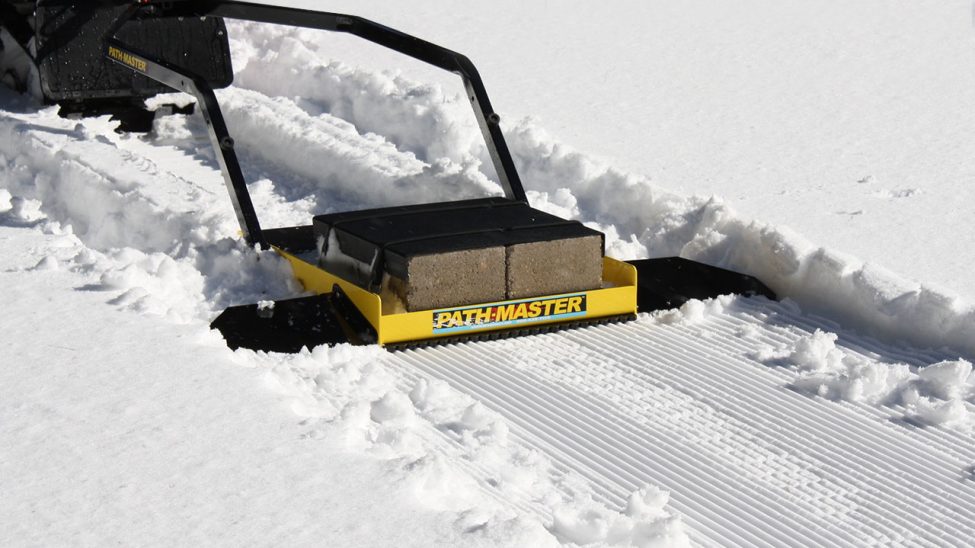Tiny trail snow groomer.