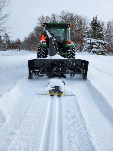 tractor laying classic XC ski trail.
