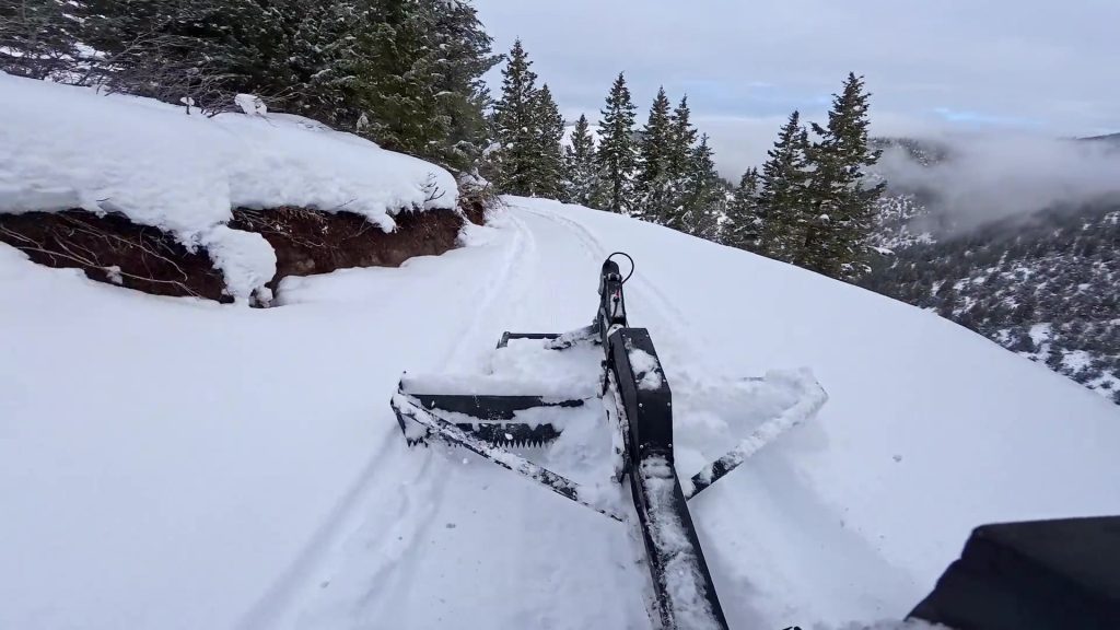 Black Snow Groomer Pro grooming corduroy on a mountain ski trail