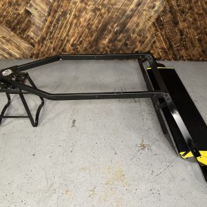 SNO-MASTER 48 V2 Standard snow groomer, hitch-end view showing the towbar frame, deflector and yellow pan end